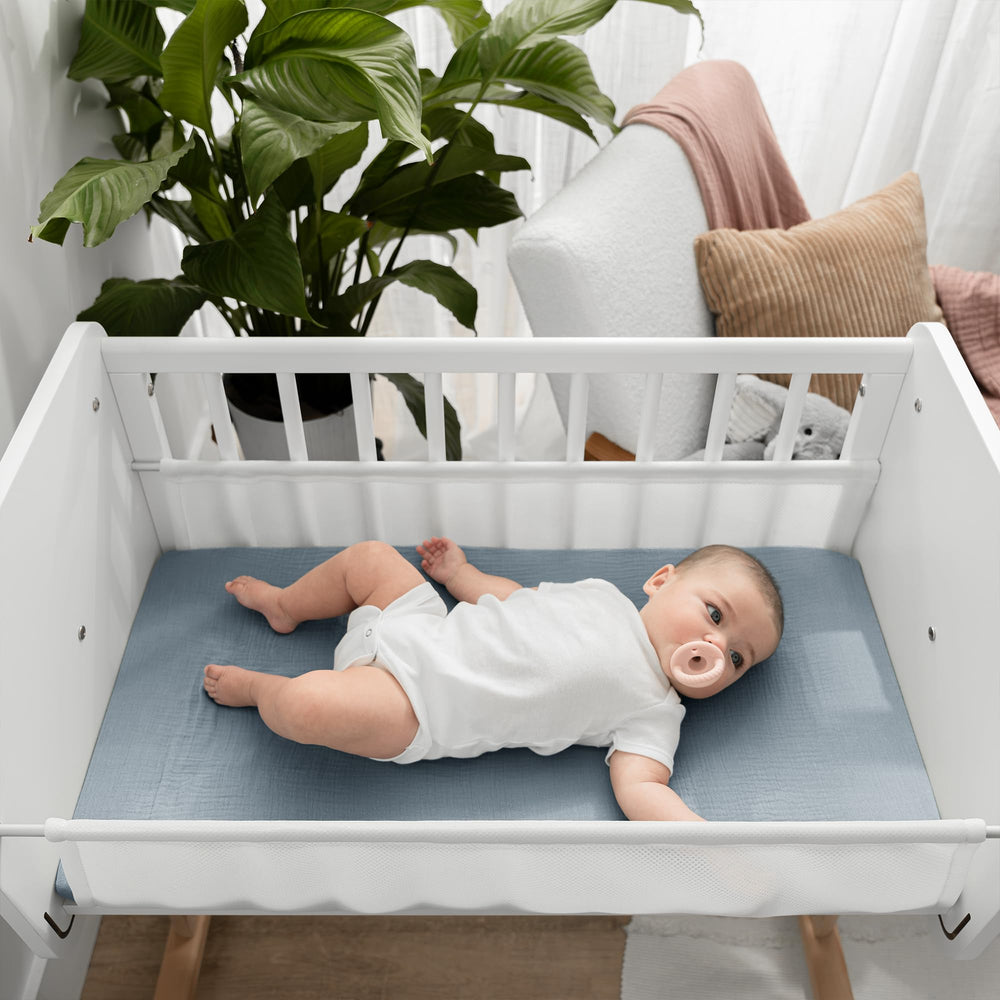 Comfy Cubs muslin bassinet sheet in Pacific Blue for a calm nursery look.