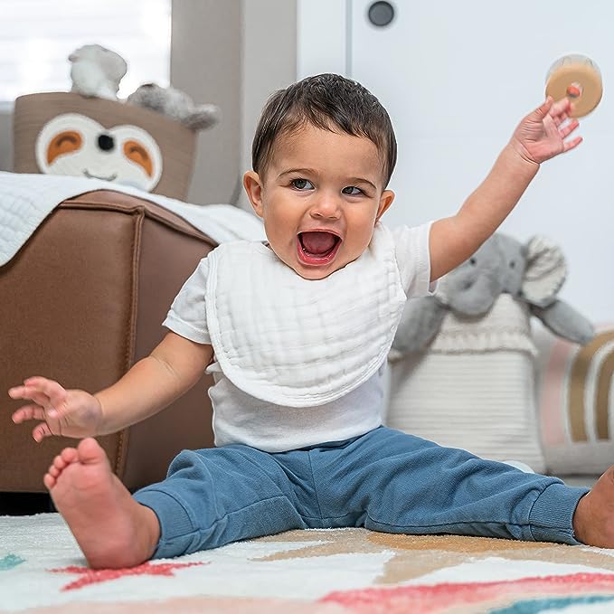 Comfy Cubs muslin bib with adjustable snaps ensuring a secure fit as baby grows.