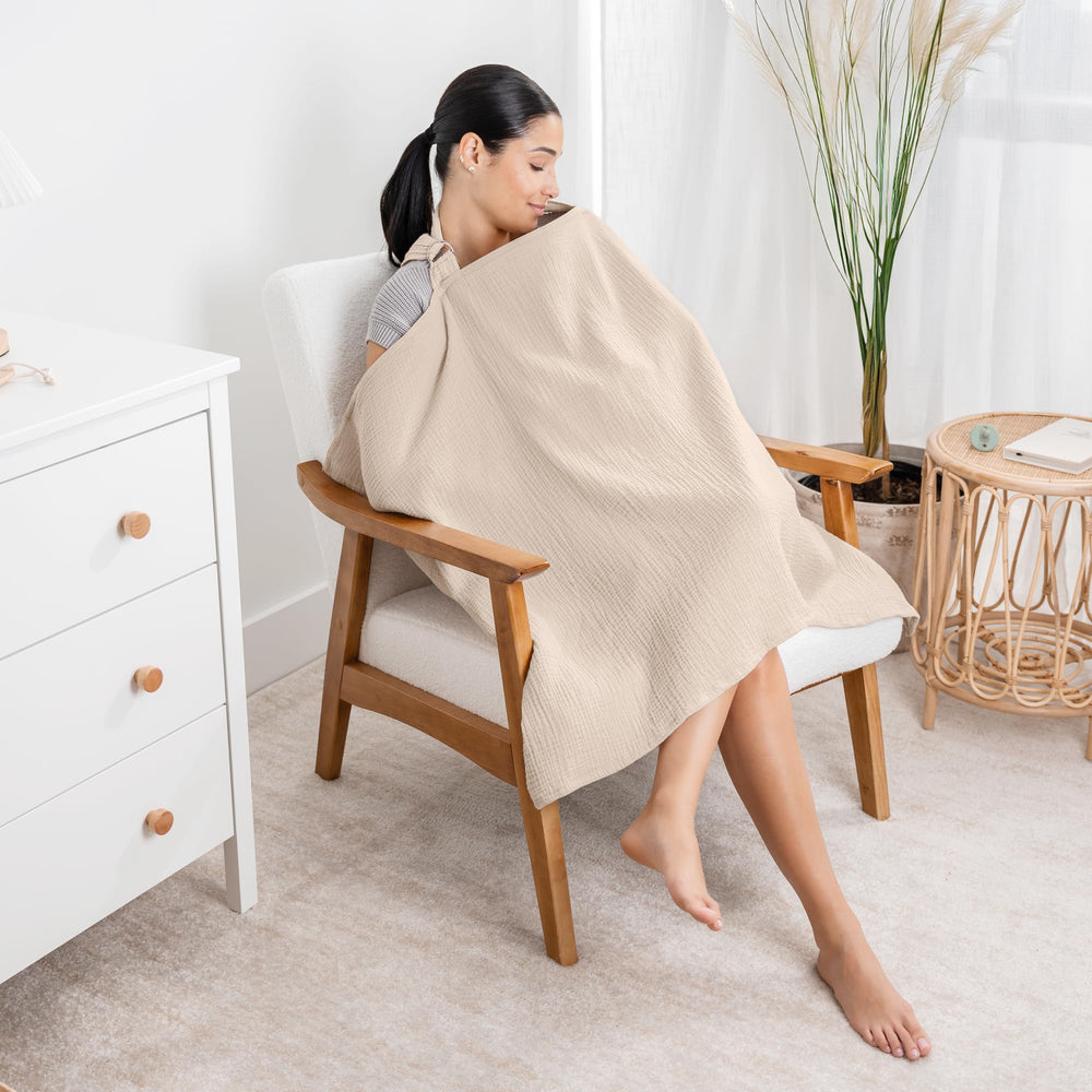 Comfy Cubs Muslin Nursing Cover folded in diaper bag demonstrates portability for on-the-go moms.