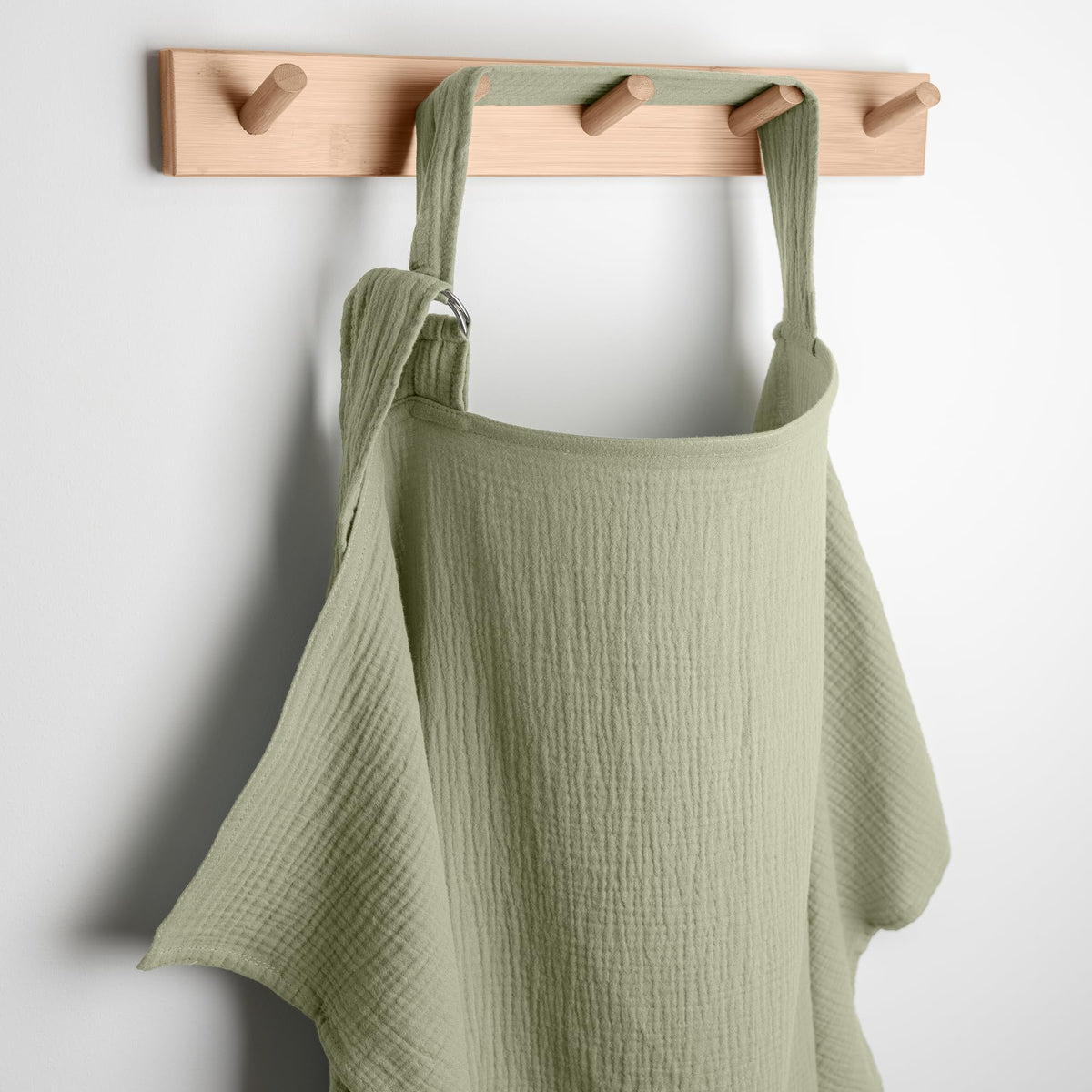 Comfy Cubs nursing cover in sage with soft airy muslin material for comfort