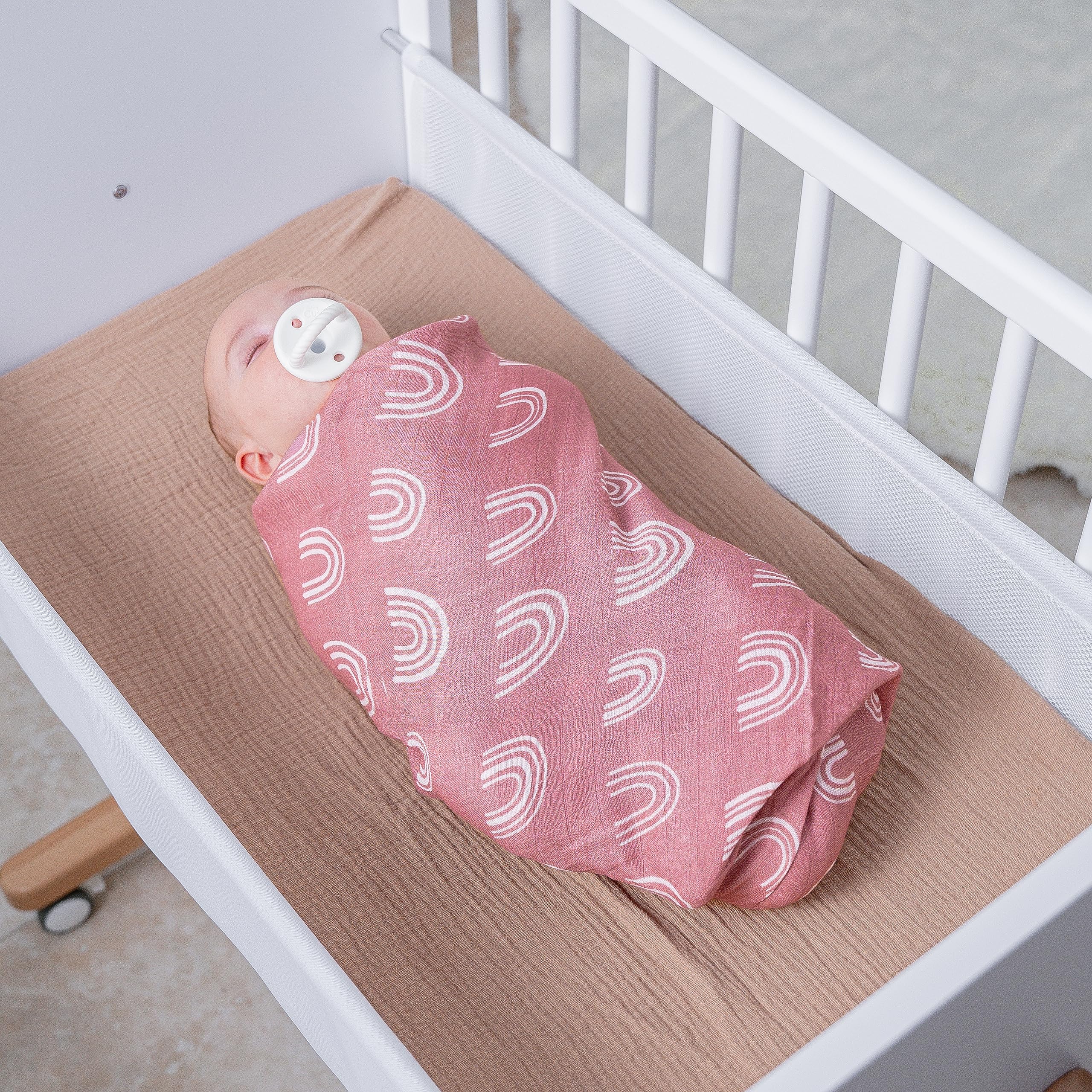Comfy Cubs muslin swaddle blanket closeup showing breathable fabric for baby skin.