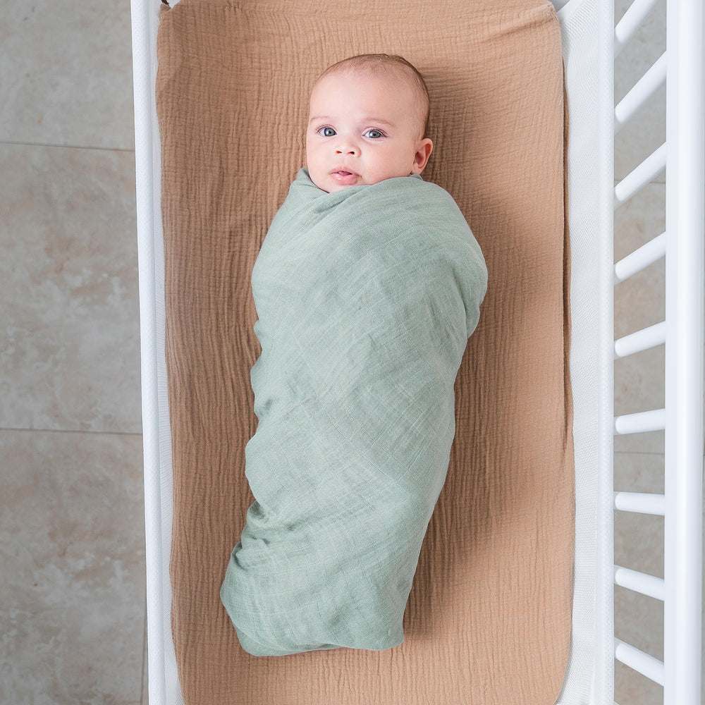 Comfy Cubs muslin swaddle blanket Fern folded neatly for storage