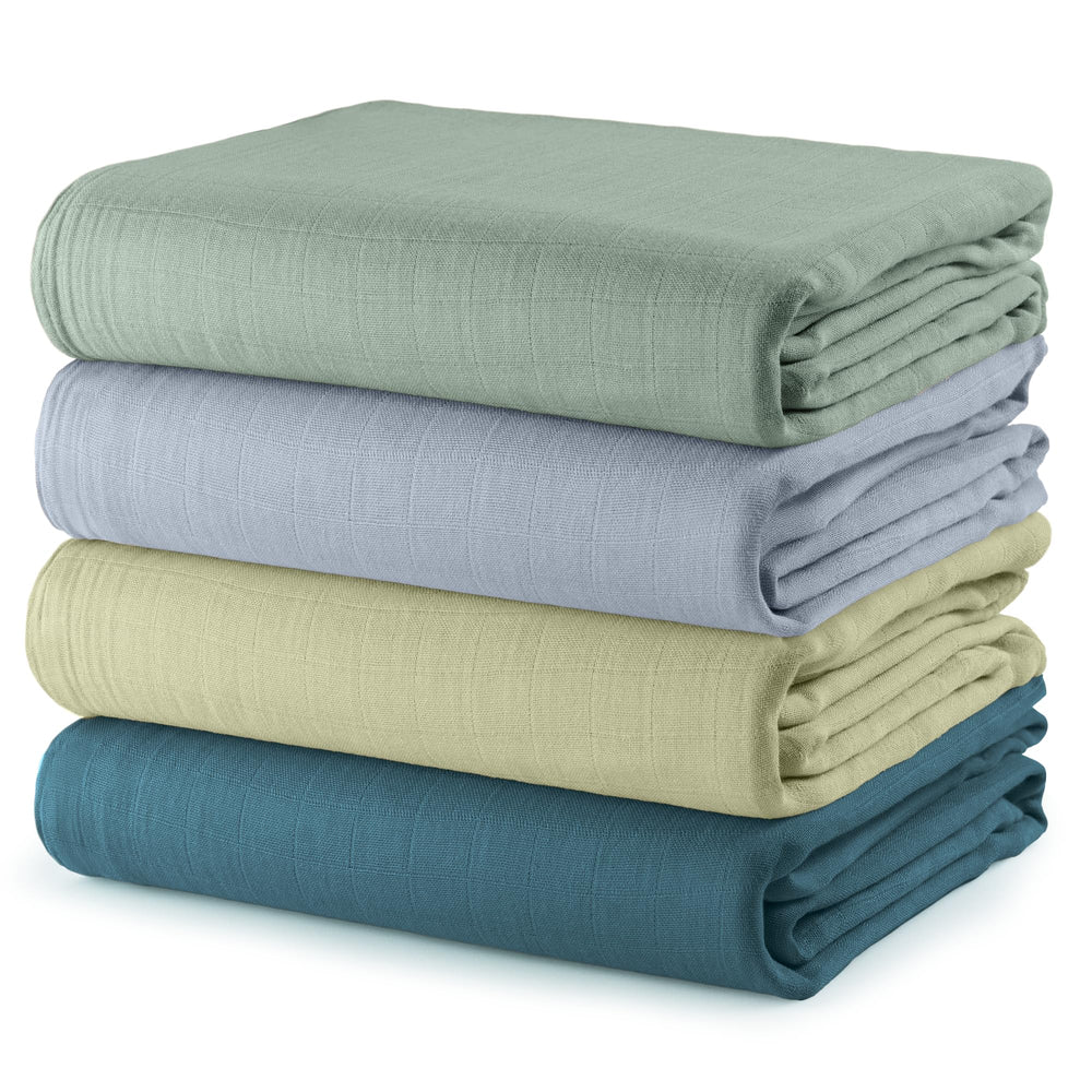 Comfy Cubs muslin swaddle pack4 blankets folded, showing soft breathable fabric for newborn comfort.