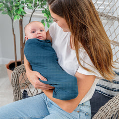 Comfy Cubs Neptune muslin swaddle blanket provides breathable comfort for year round use.