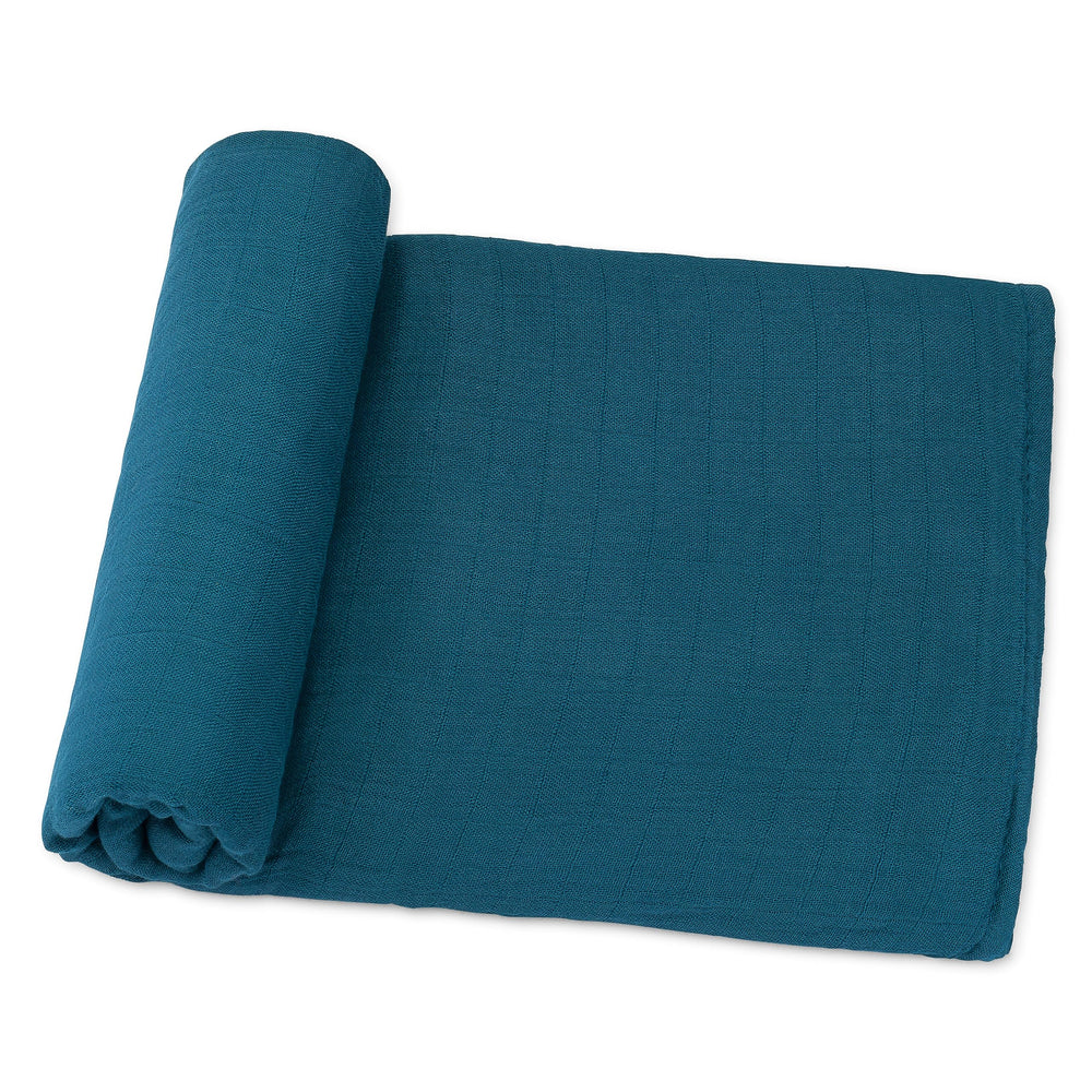 Comfy Cubs Neptune muslin swaddle blanket offers full coverage for secure swaddling and cozy days.