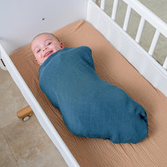 Comfy Cubs Neptune muslin swaddle blanket ideal for tummy time and easy transitions.