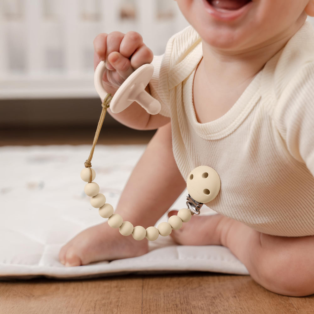 Comfy Cubs beige and light-beige color options shown for coordinated baby outfits