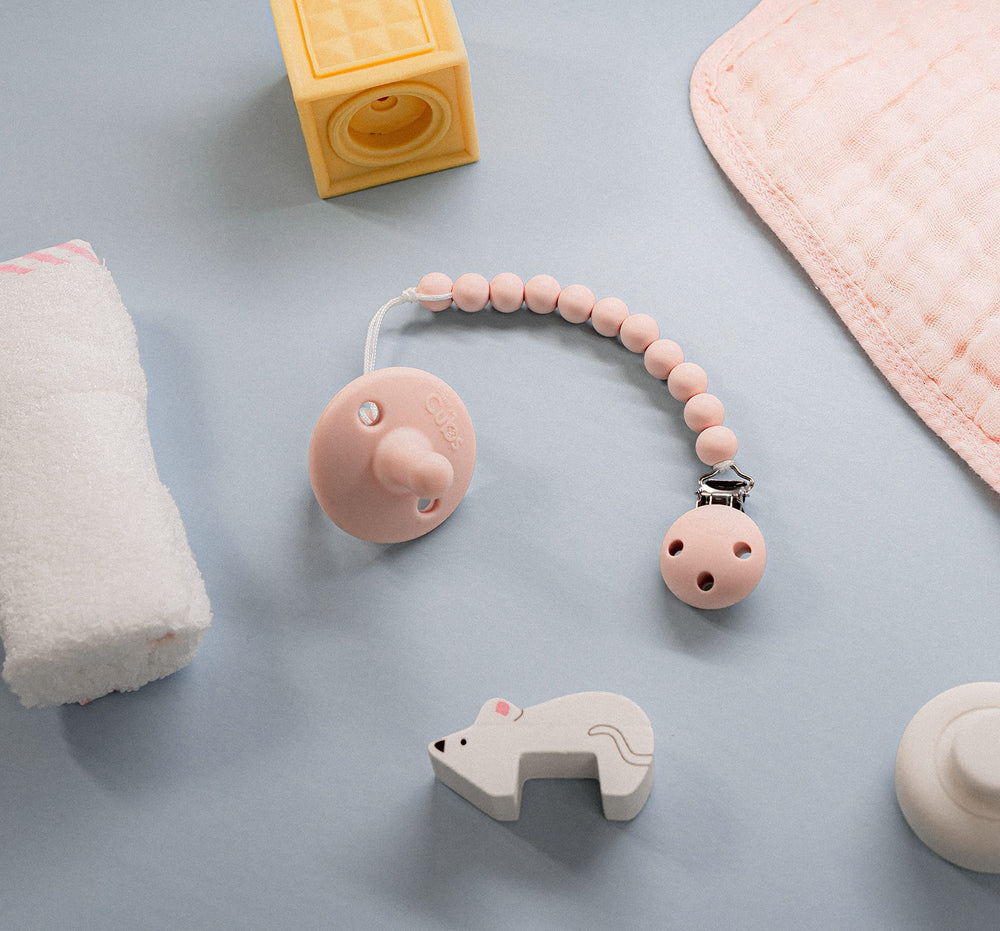 Comfy Cubs stage-2 pink pacifiers shown for everyday soothing and teething support.