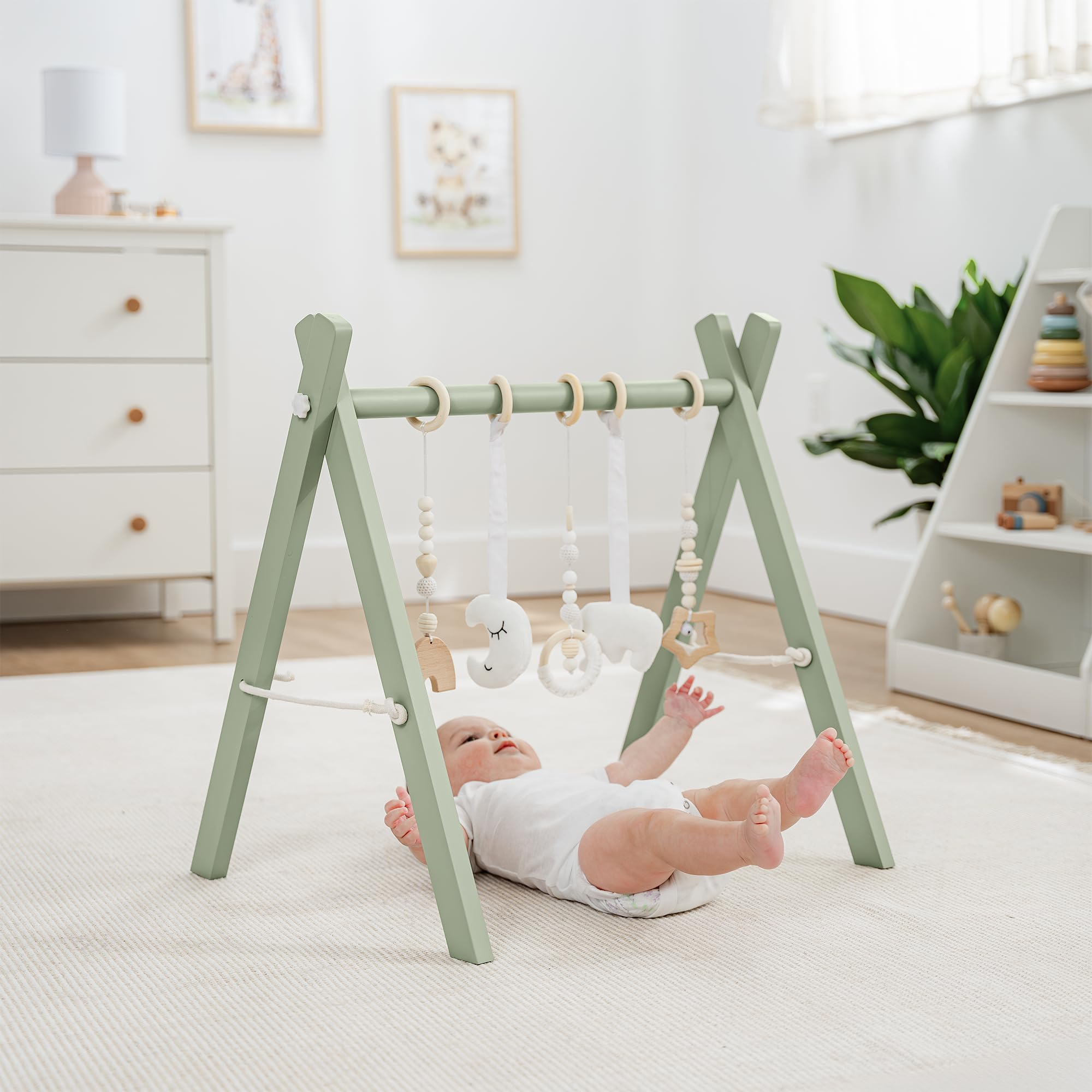 Comfy Cubs play gym side view highlights compact, room-friendly footprint.