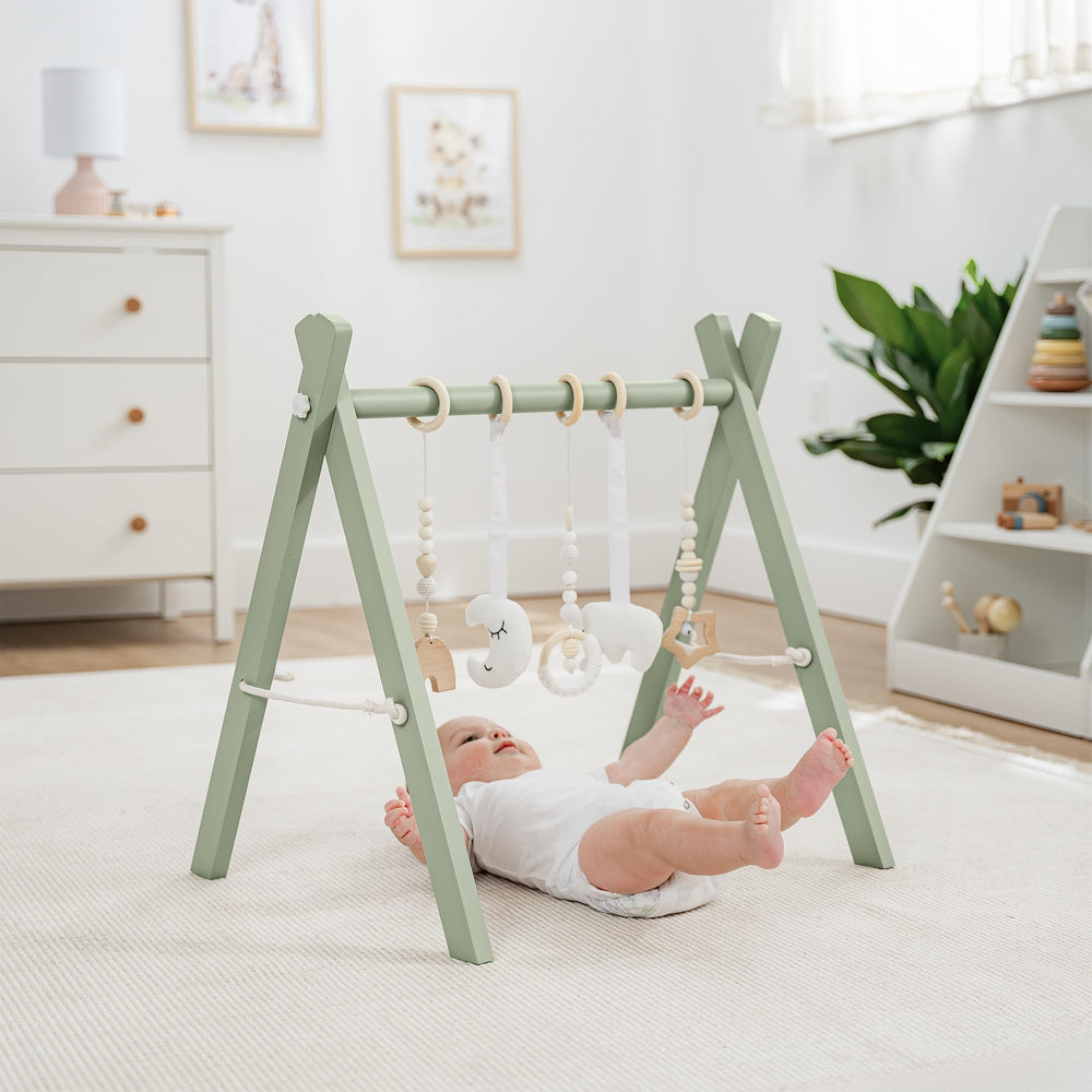 Comfy Cubs play gym side view highlights compact, room-friendly footprint.