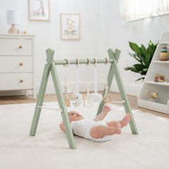 Comfy Cubs play gym side view highlights compact, room-friendly footprint.