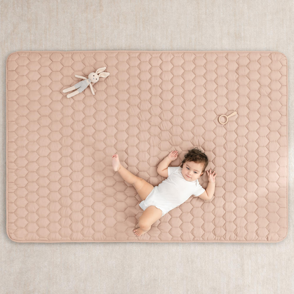 Comfy Cubs rectangle play mat blush kids playing on a cushioned surface