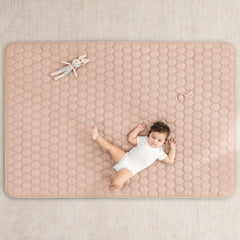 Comfy Cubs rectangle play mat blush kids playing on a cushioned surface