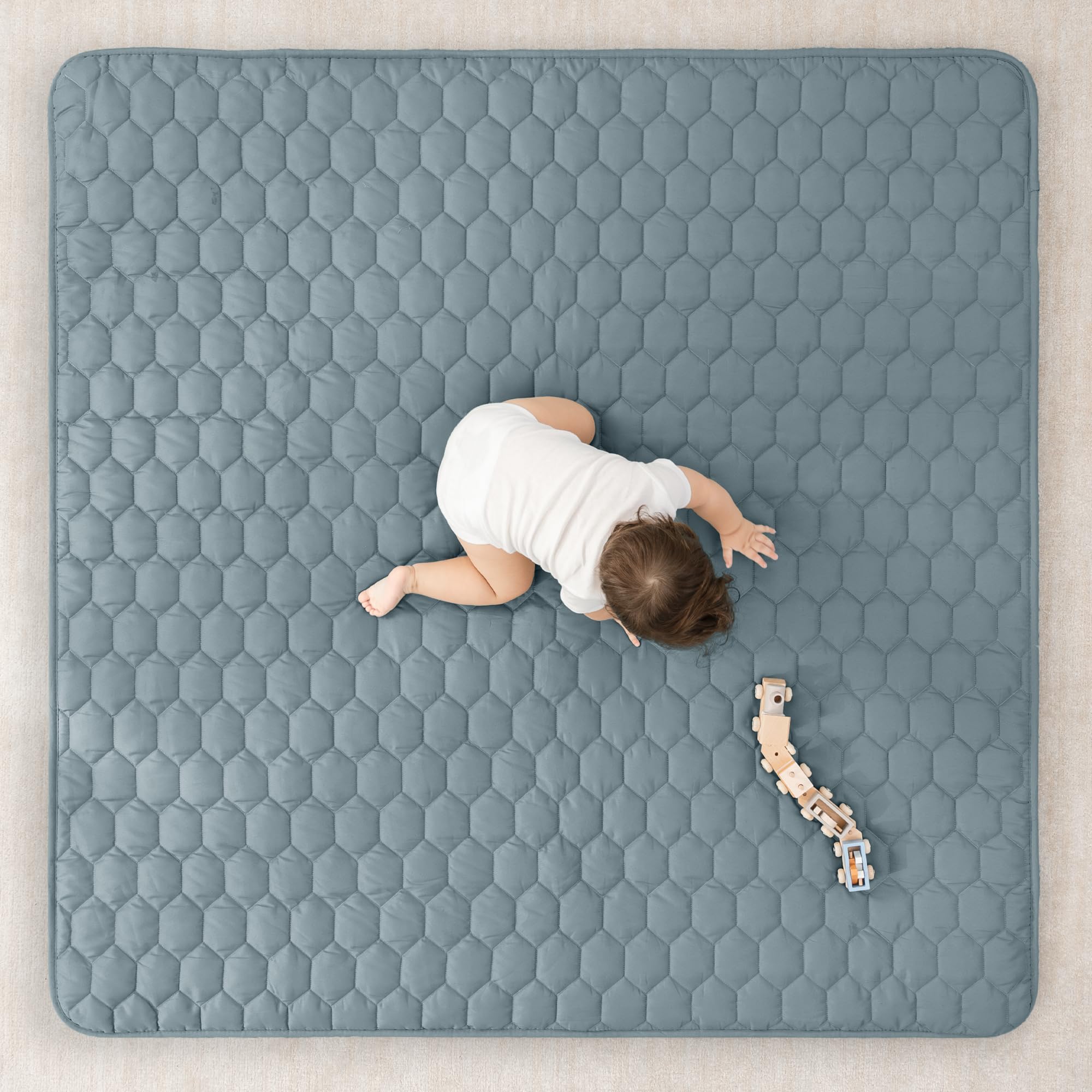 Comfy Cubs square Pacific Blue mat with non-slip bottom for stable play.