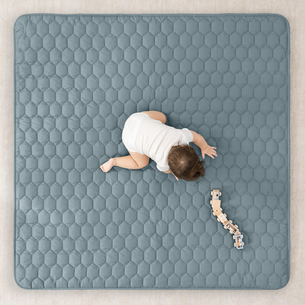 Comfy Cubs square Pacific Blue mat with non-slip bottom for stable play.