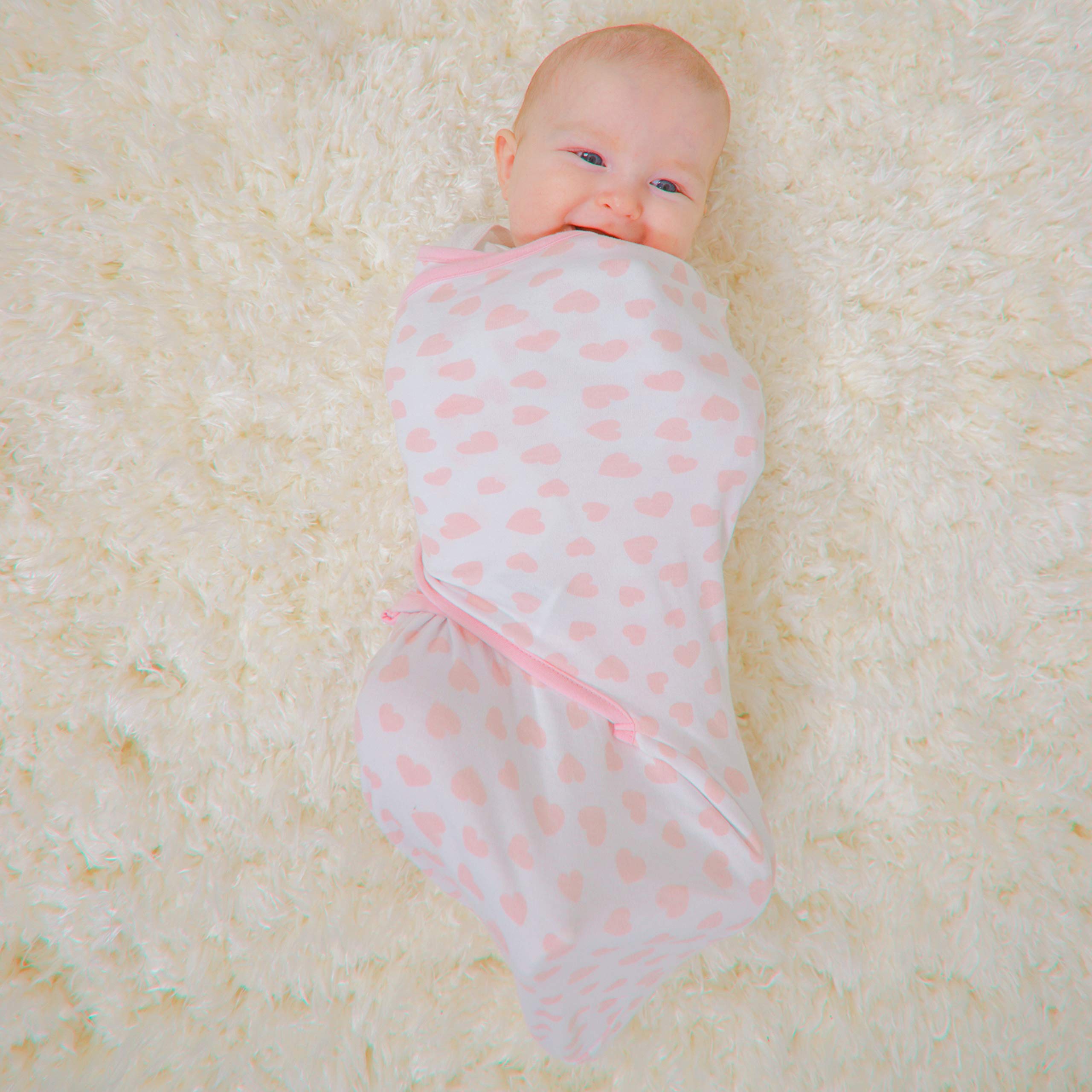 Baby in stroller swaddled with Comfy Cubs pink wrap.