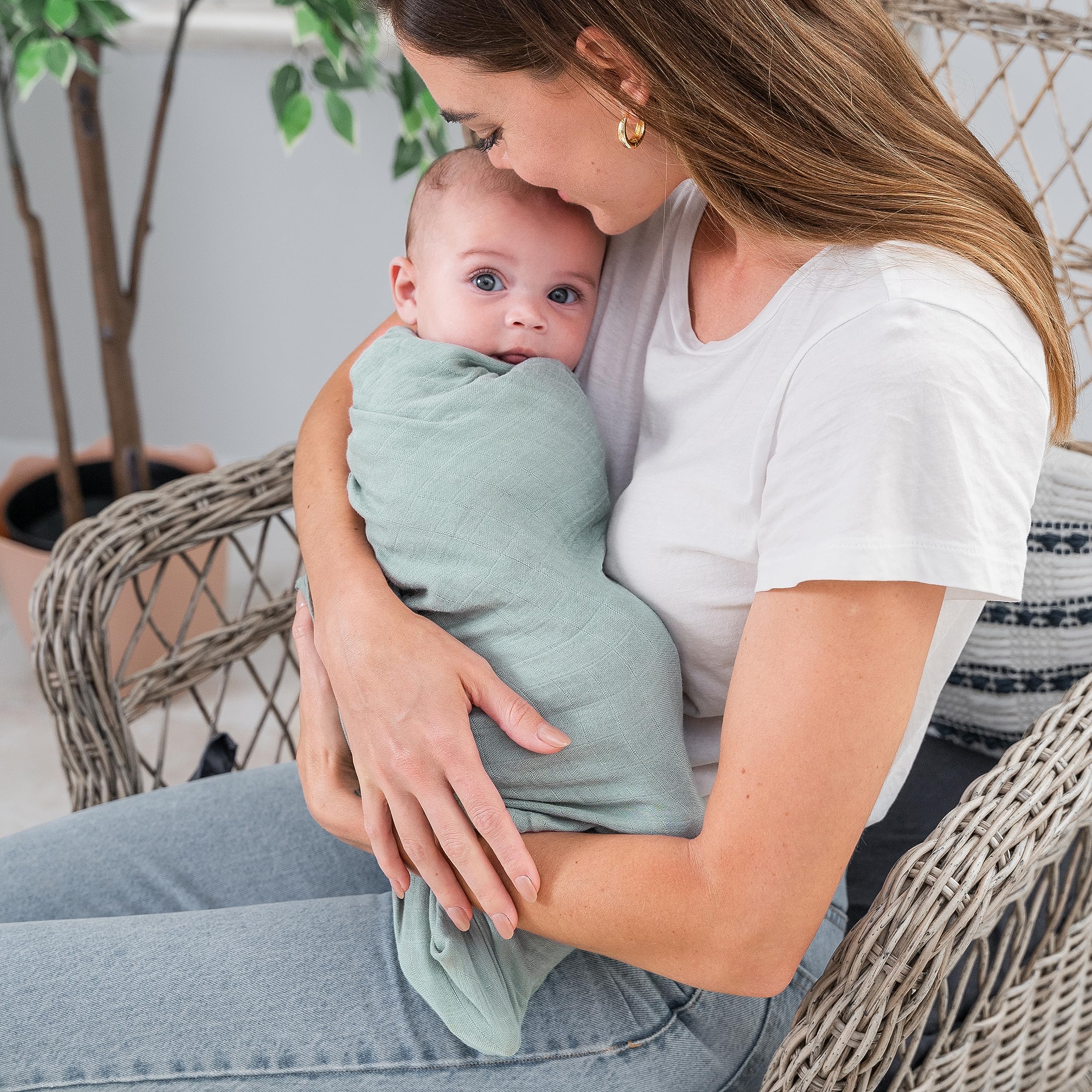Comfy Cubs swaddle in Sage Neptune Fern Pacific Blue colors offers versatile nursery styling.