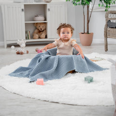 Comfy Cubs waffle blanket folded for bed or couch demonstrates versatile bed, couch, or travel cover.
