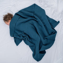 Comfy Cubs waffle blanket swaddle use demonstrates versatile newborn comfort on the go.