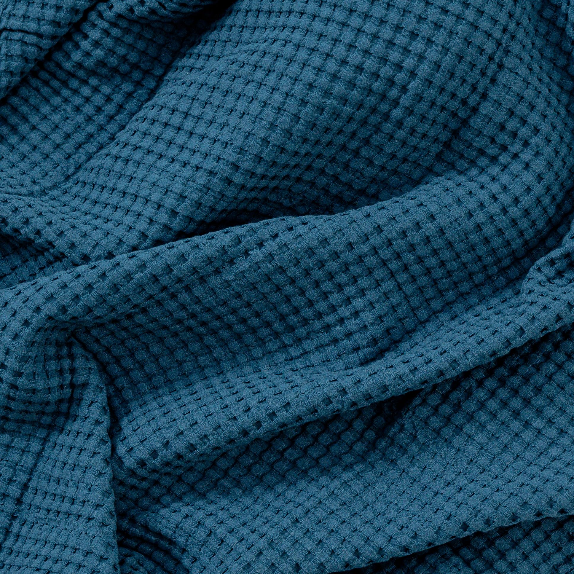 Comfy Cubs waffle blanket ideal for travel and crib use during outings with baby.
