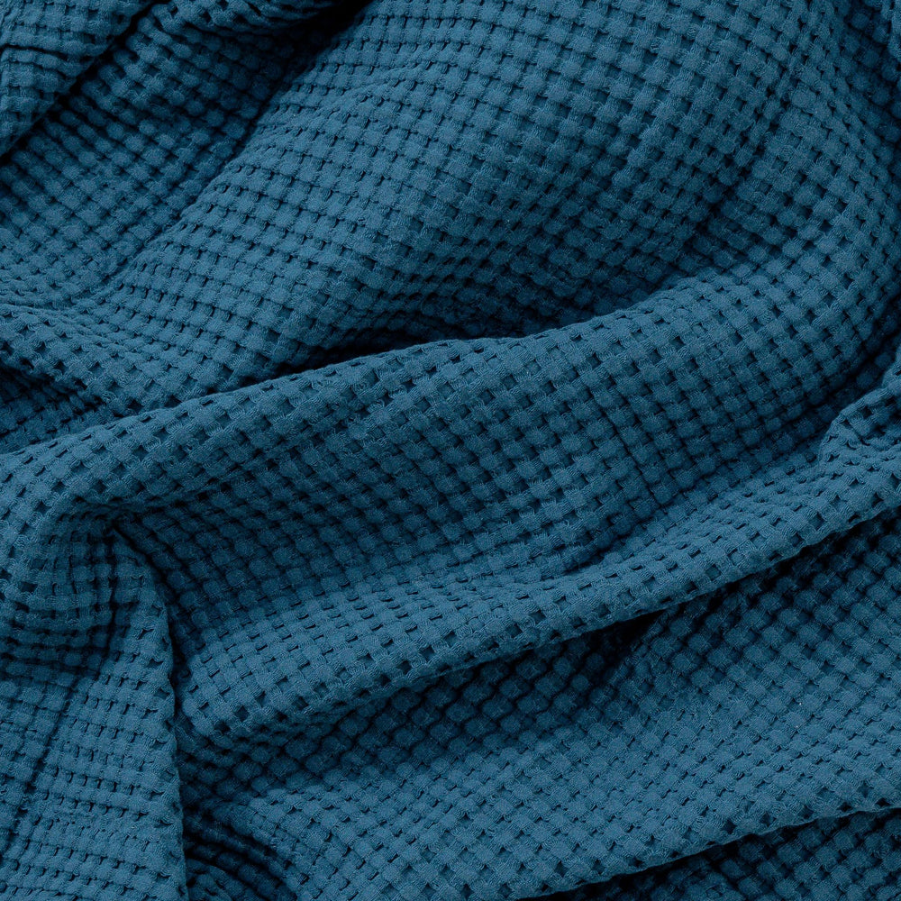 Comfy Cubs waffle blanket ideal for travel and crib use during outings with baby.