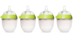 Comotomo four-pack 5 oz green bottles show easy-clean wide neck design for busy parents