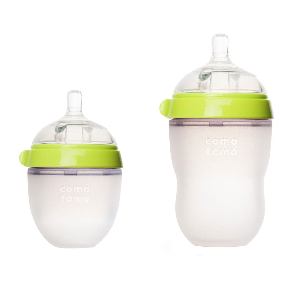 Comotomo natural-feel baby bottles in green pack with soft silicone nipples for natural-feeding comfort.