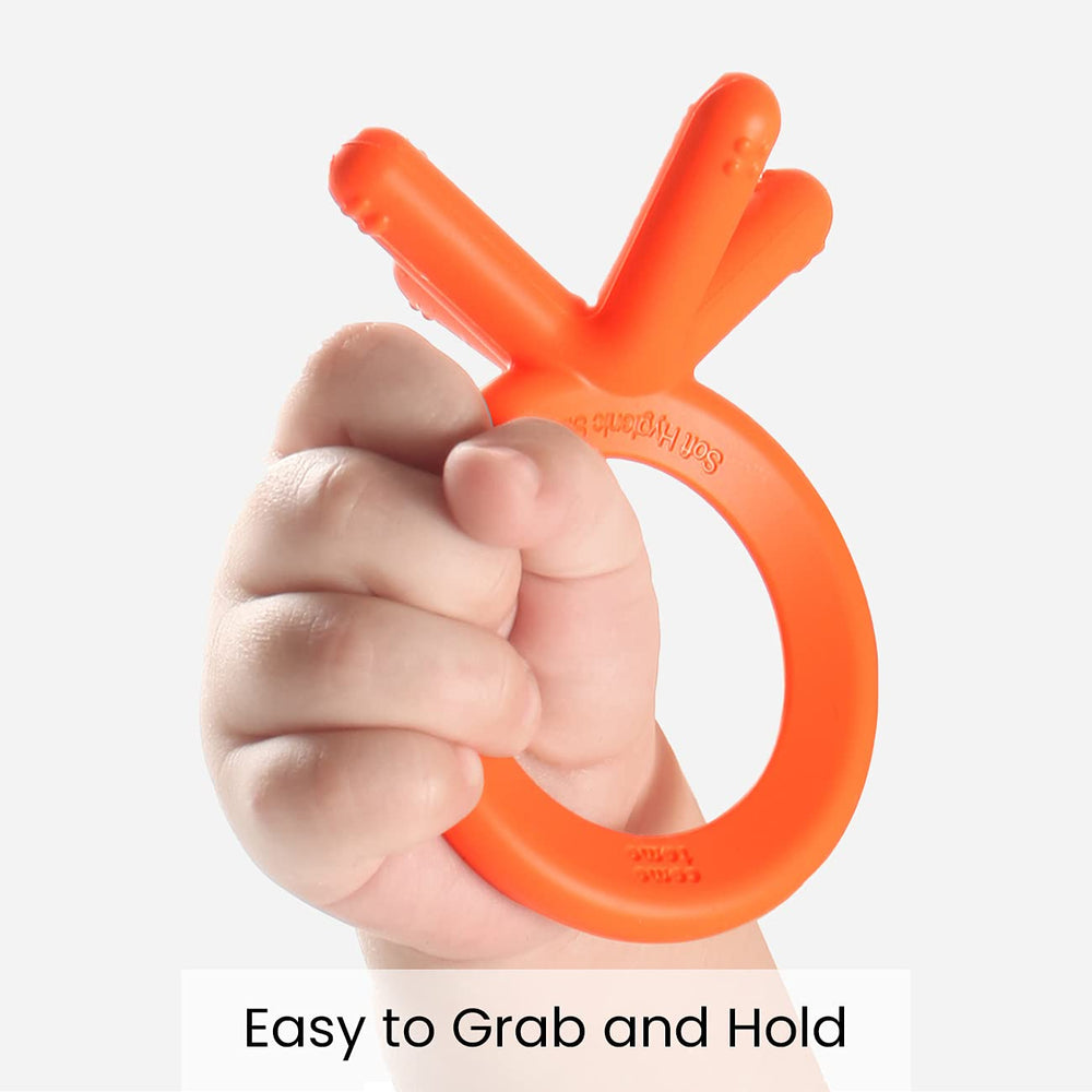 Comotomo teether orange grip showing easy-to-hold design for tiny hands.