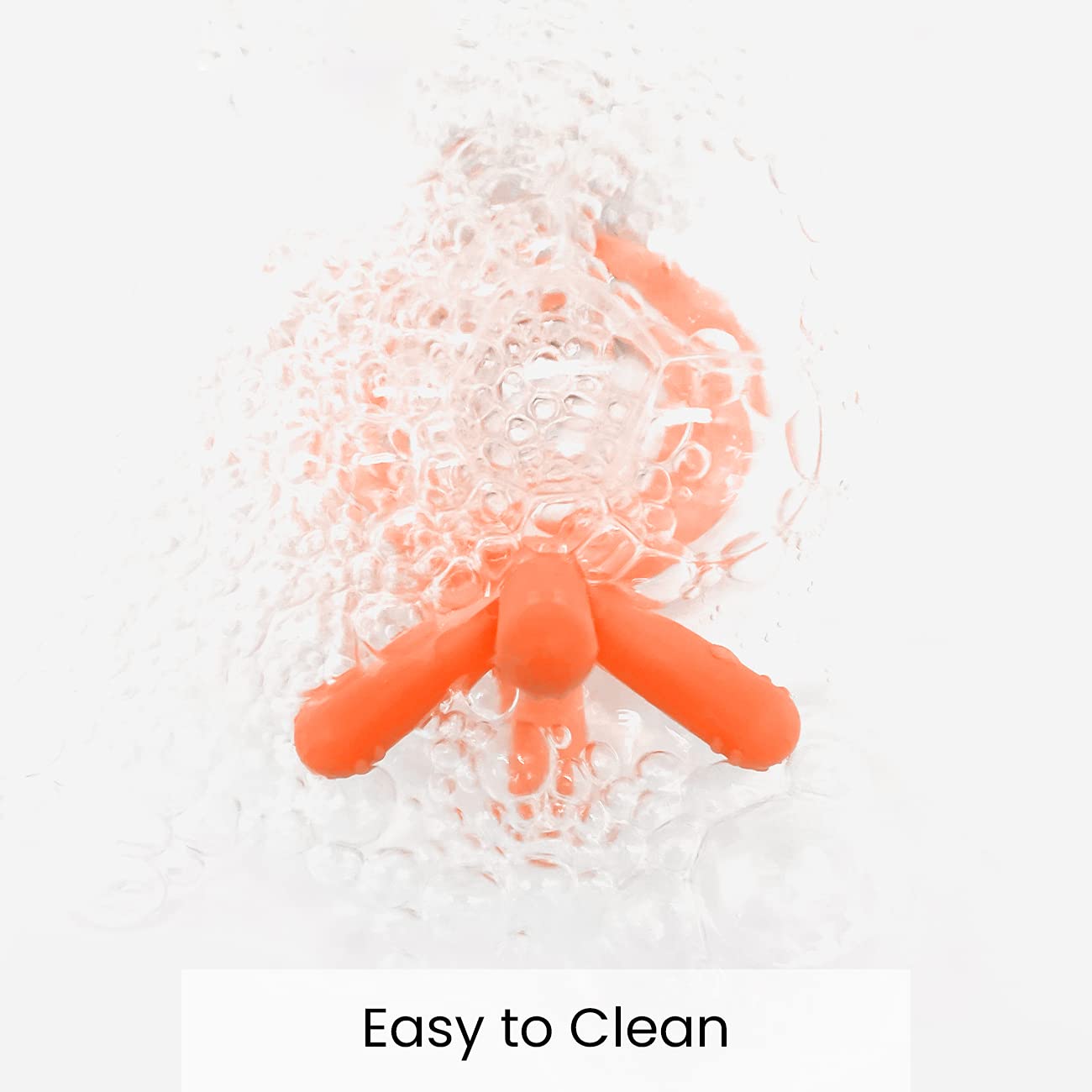 Comotomo teether orange material silicone emphasizing durable, safe chewing material.