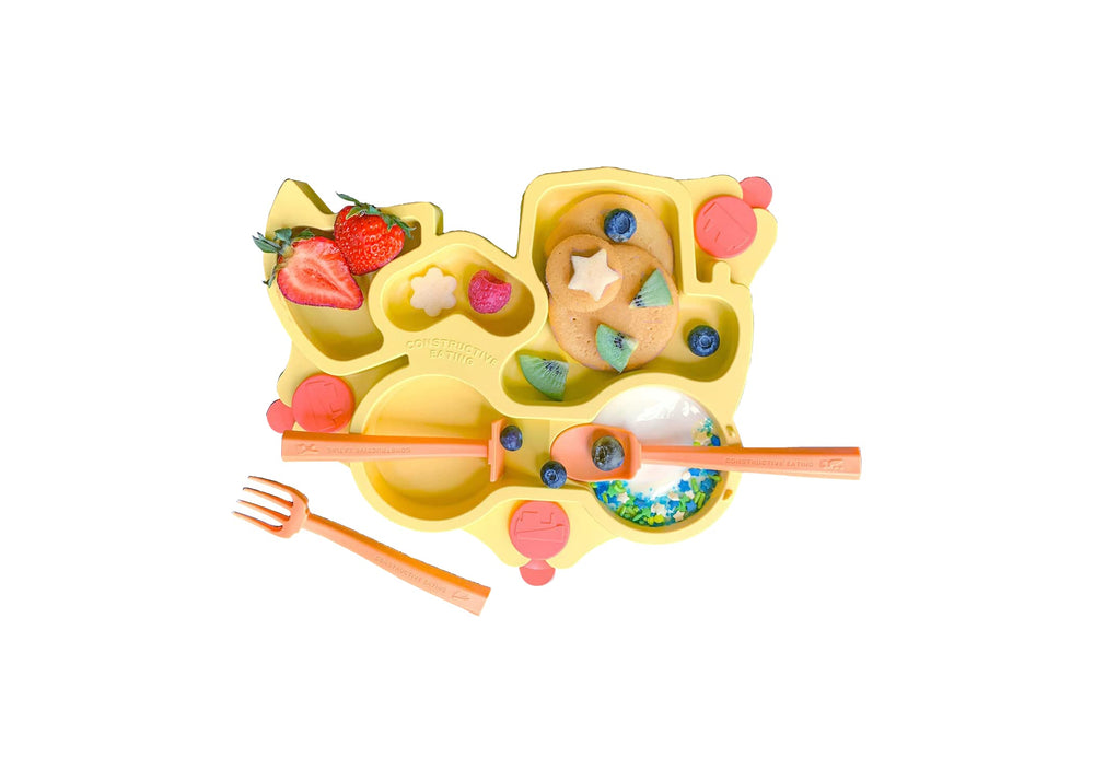 Constructive Eating yellow truck-dining setup promotes imaginative meals around the table