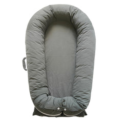 CooCooBaby Deluxe Lounger cocoon provides snug newborn comfort for everyday naps.