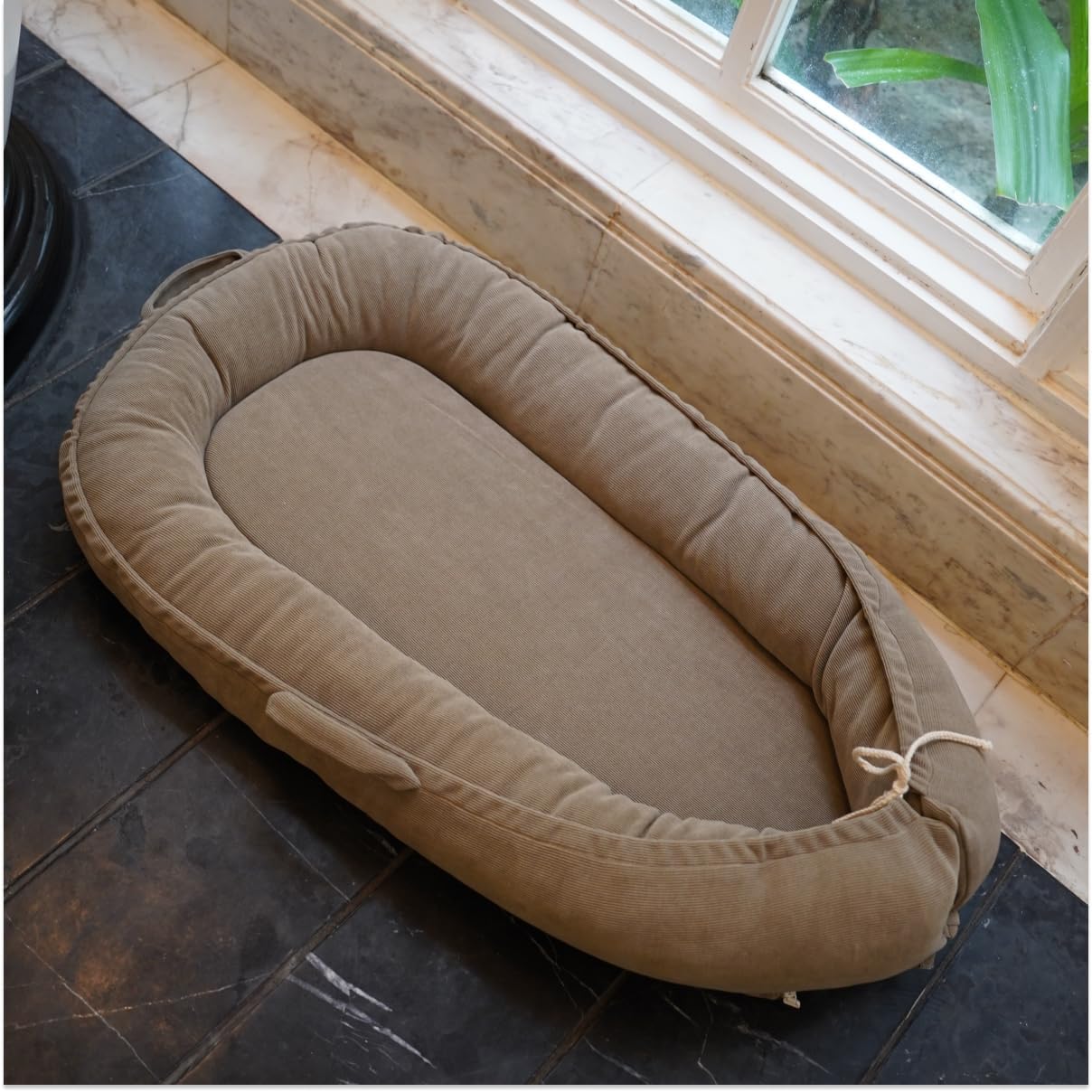 CooCooBaby family-friendly lounger used during tummy time and cuddling moments.