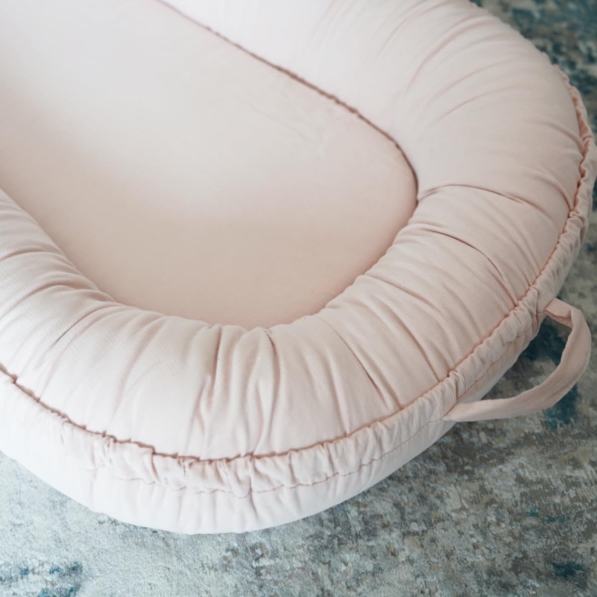 CooCooBaby breathable fabric detail highlights cream color and cotton comfort for everyday use.