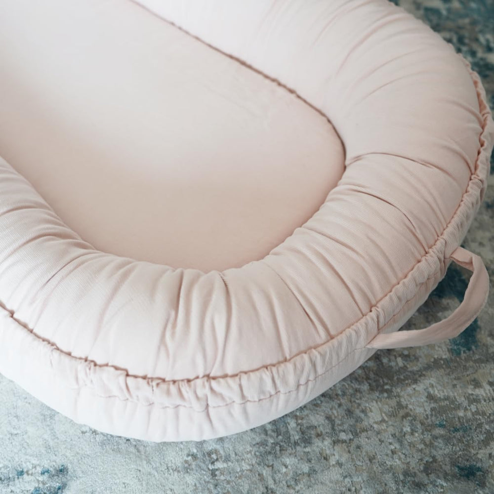 CooCooBaby breathable fabric detail highlights cream color and cotton comfort for everyday use.