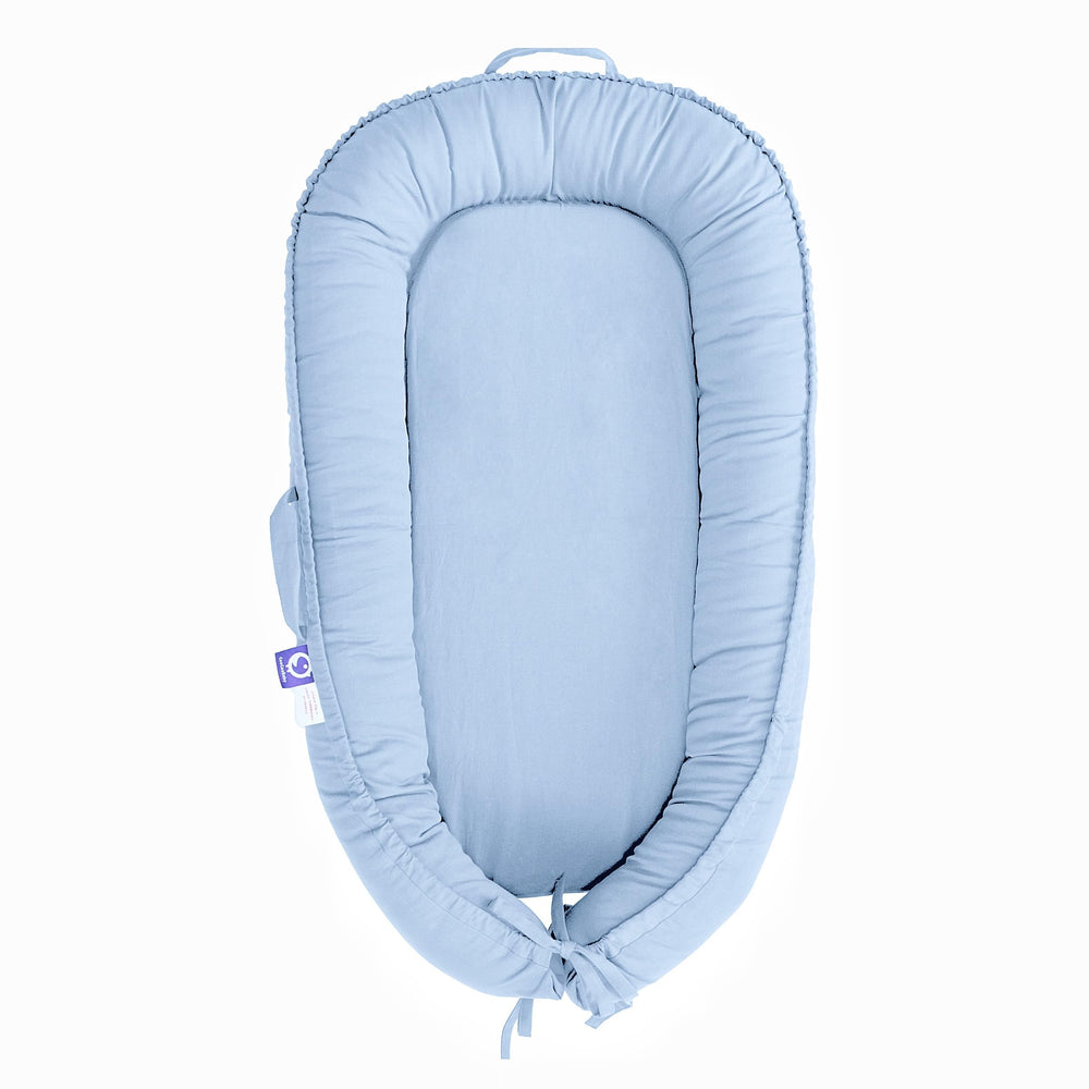 CooCooBaby infant lounger cover closeup shows breathable cotton for gentle comfort.