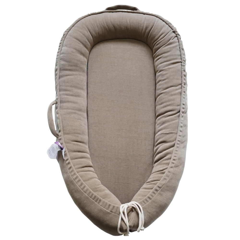 CooCooBaby infant lounger Fields of Rye corduroy - breathable cuddling comfort for soothing moments.
