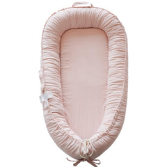 CooCooBaby infant lounger closeup in Mistyrose Corduroy for breathable cuddly comfort