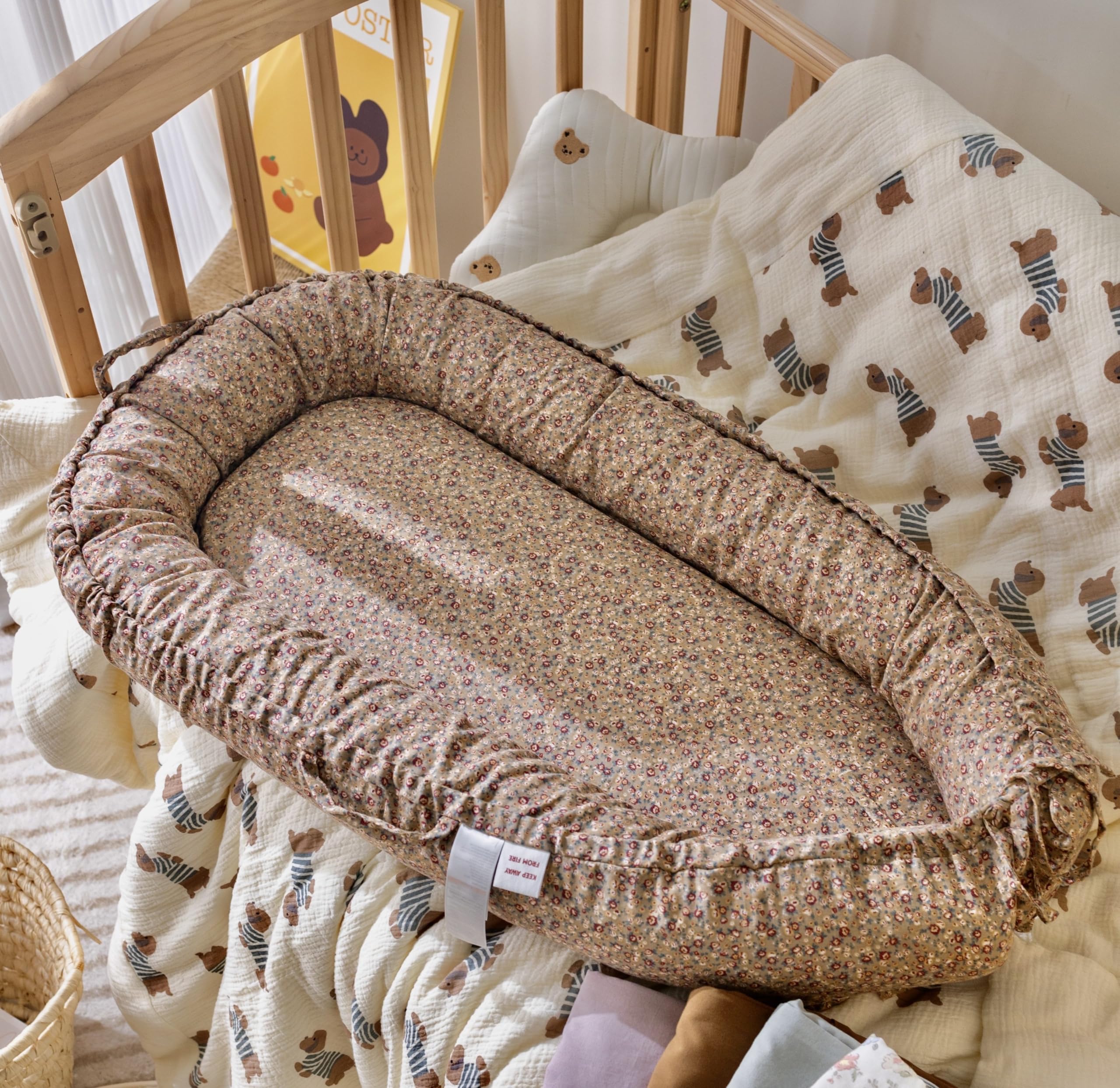 CooCooBaby infant lounger close-up shows breathable cotton texture for comfy naps.