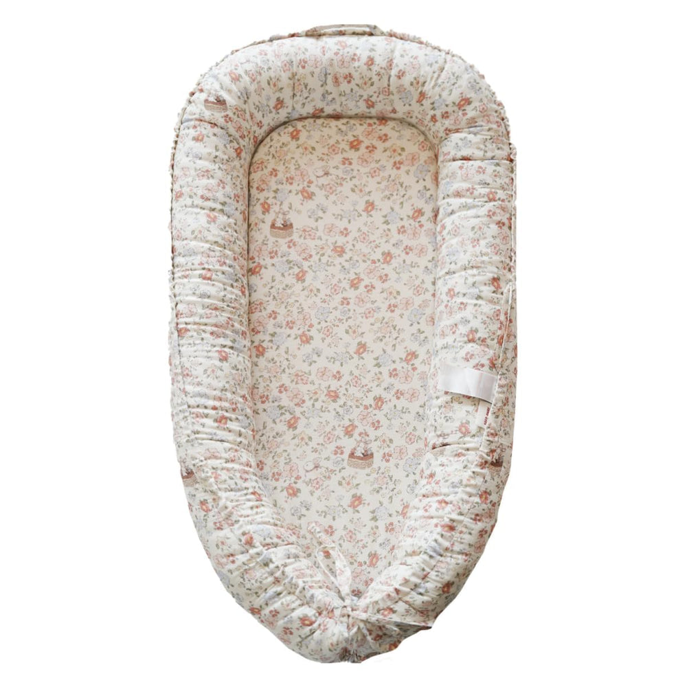 CooCooBaby infant lounger Wonderland Muslin close-up showcasing breathable cotton for gentle baby comfort.