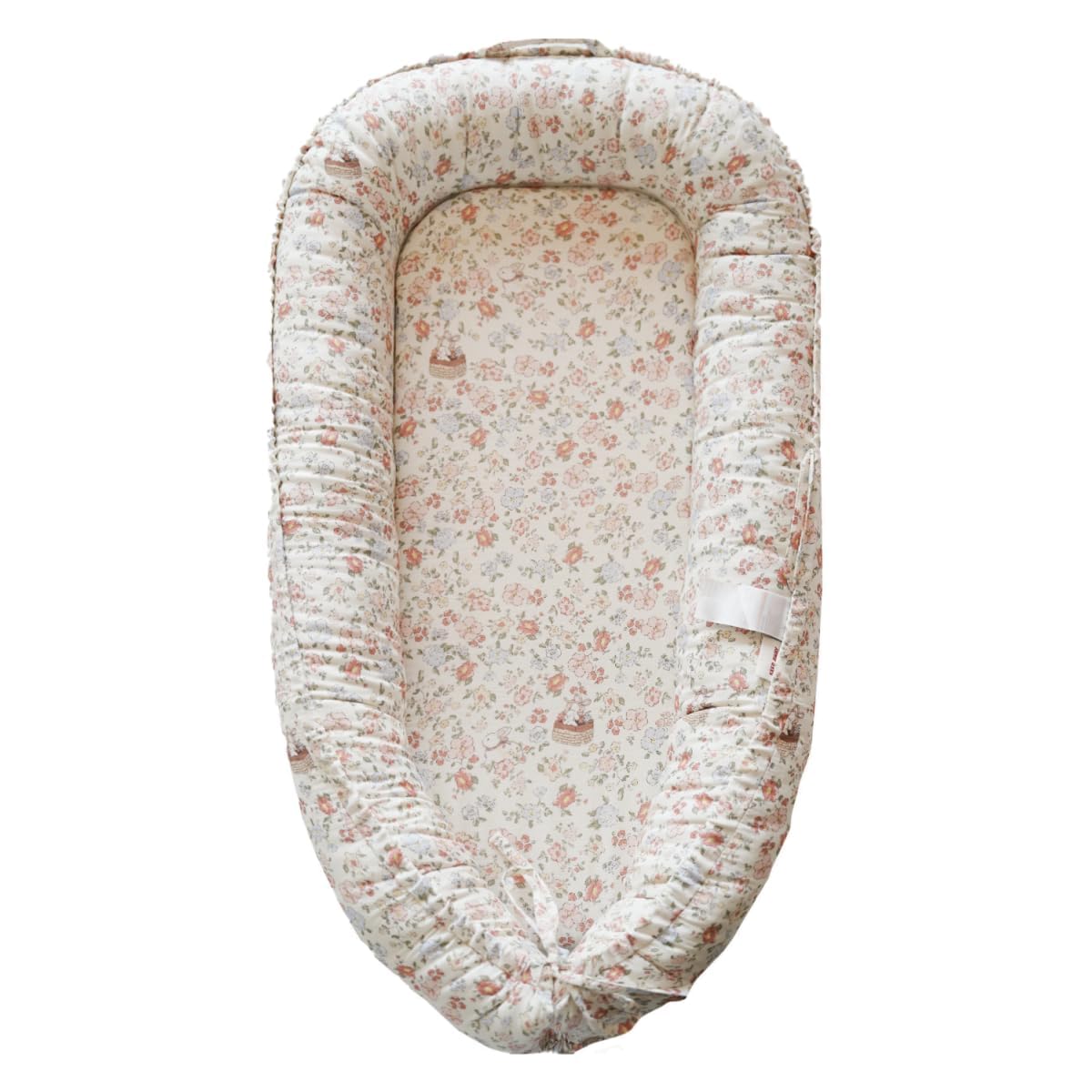 CooCooBaby infant lounger Wonderland Muslin close-up showcasing breathable cotton for gentle baby comfort.