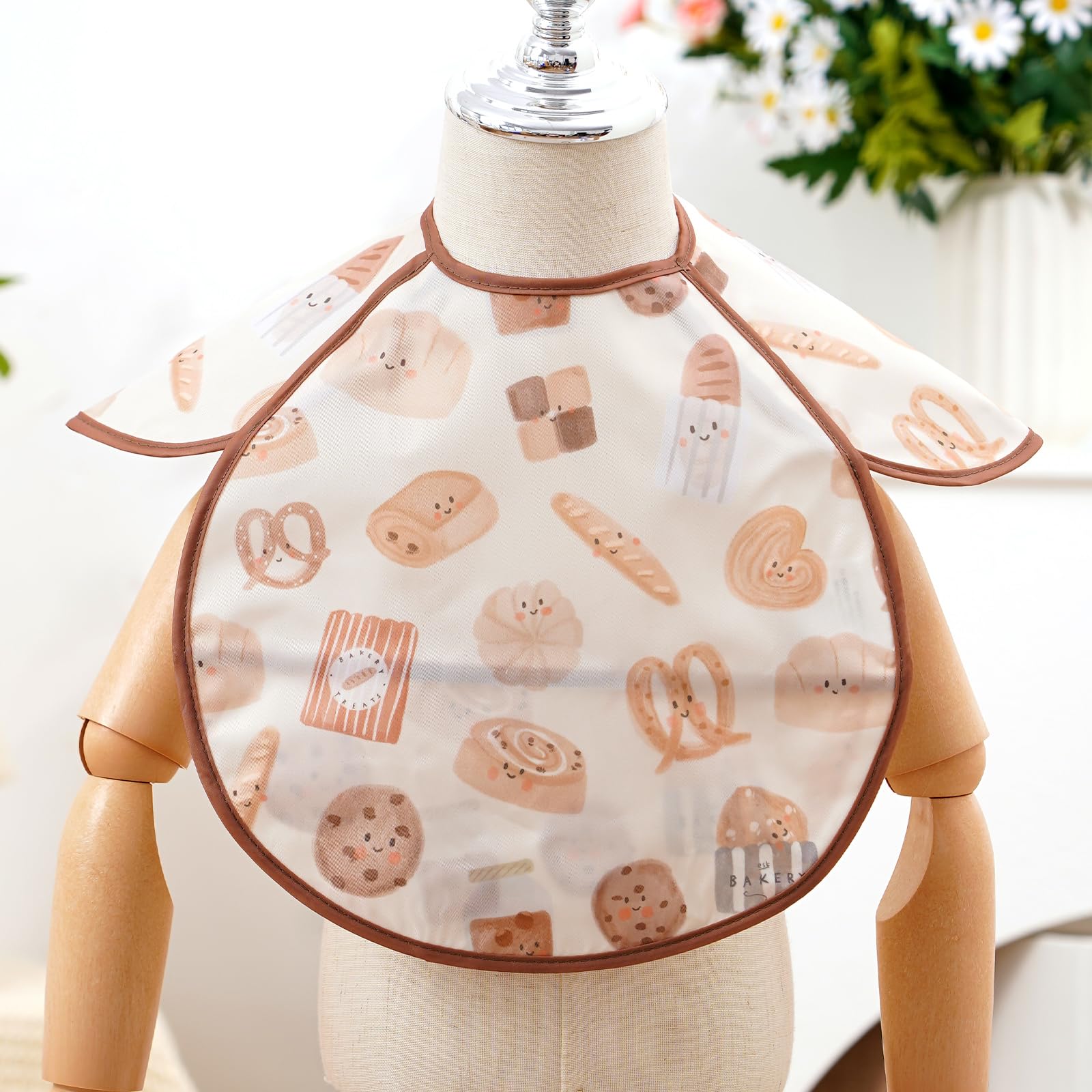 CoolaPeach bib rolled for travel demonstration highlights portability and on-the-go use