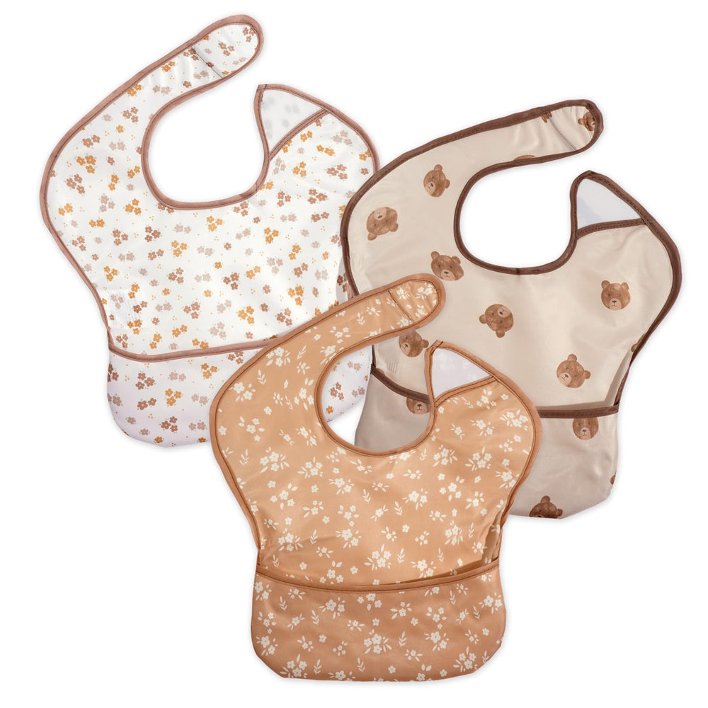 CoolaPeach bibs three-pack front view with bear and flower designs for mess-prone meals