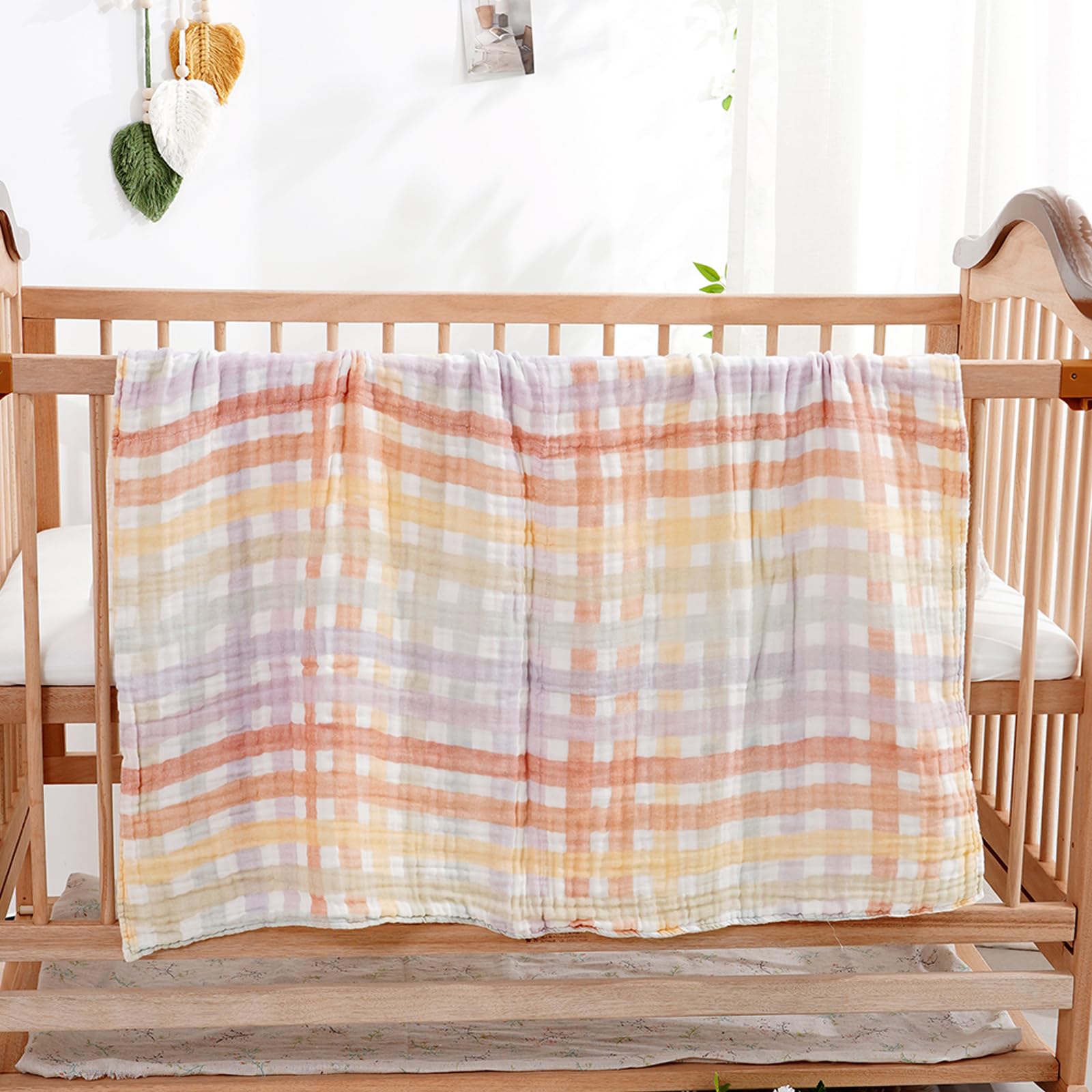 CoolaPeach multipurpose baby blanket serves as swaddle, burp cloth, or nursing cover.