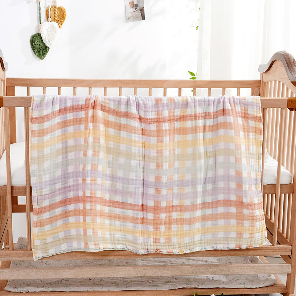 CoolaPeach multipurpose baby blanket serves as swaddle, burp cloth, or nursing cover.