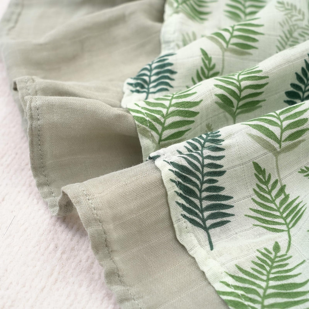 CoolaPeach muslin swaddle baby-naptime-use demonstrates cozy wrap for quick naps