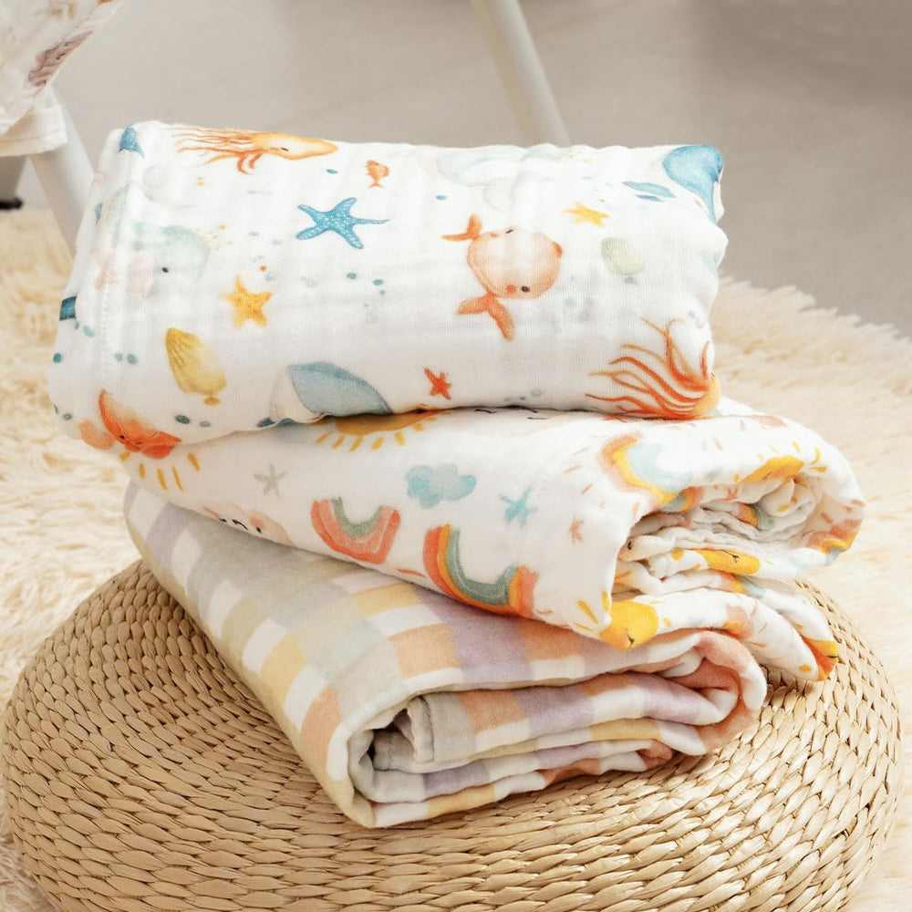 CoolaPeach muslin swaddle blanket in use as nursing cover and wrap