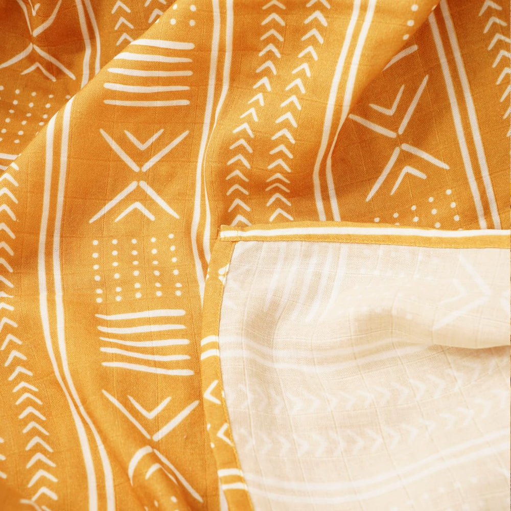 CoolaPeach muslin swaddle blanket diaper pad use, handy multi-use for changes and spills.