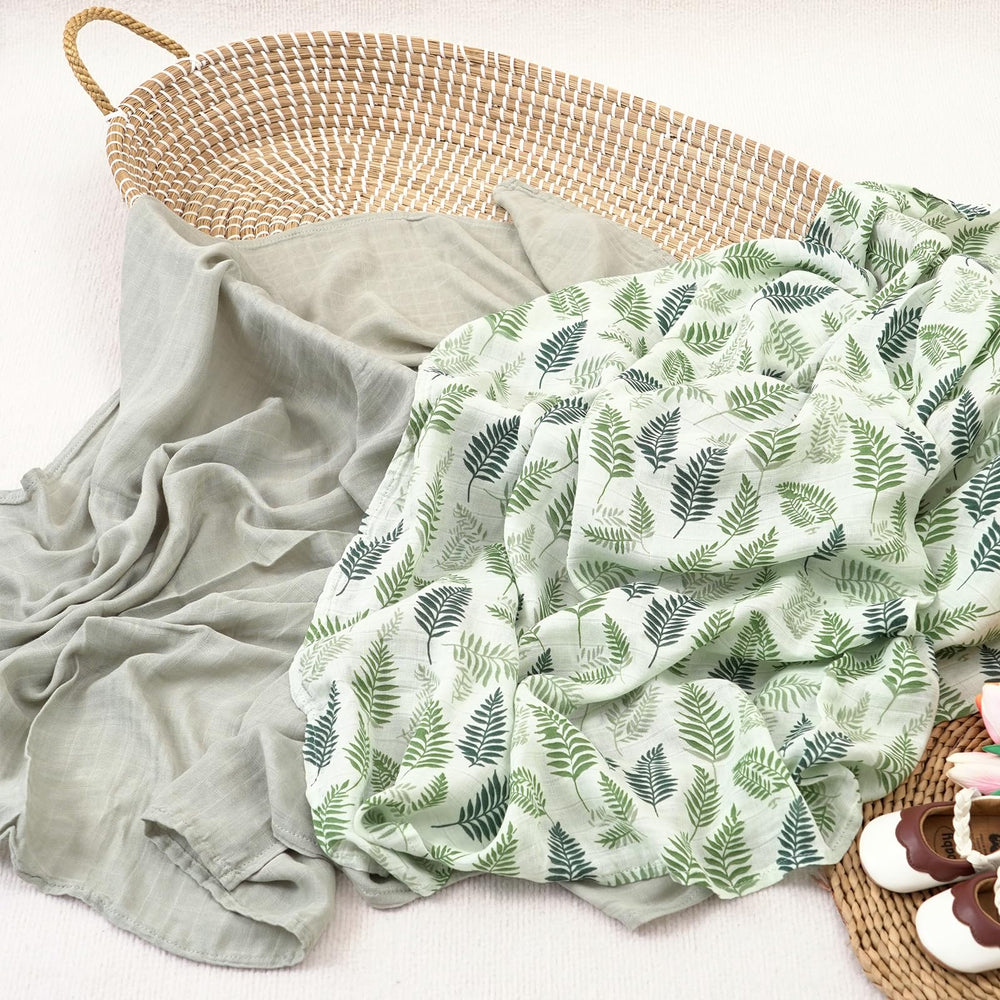CoolaPeach muslin swaddle leaf-pattern-closeup highlights soft texture for delicate skin