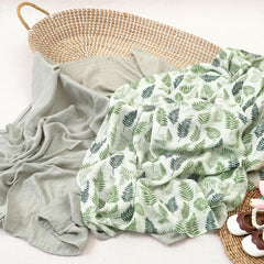 CoolaPeach muslin swaddle leaf-pattern-closeup highlights soft texture for delicate skin