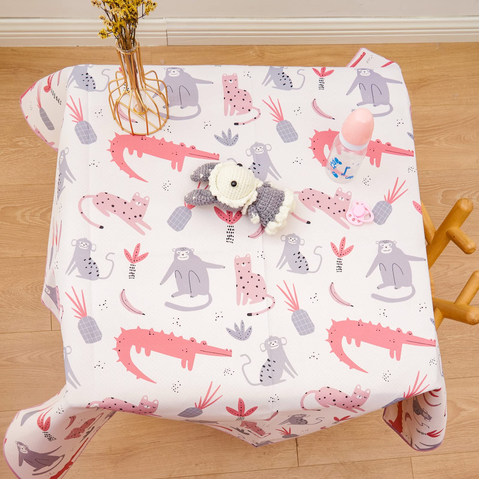 CoolaPeach Splat Mat under high chair stays in place, catching spills.